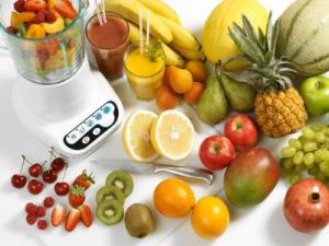 Array of Fresh Fruits Next to Blender --- Image by © Steve Lupton/Corbis
